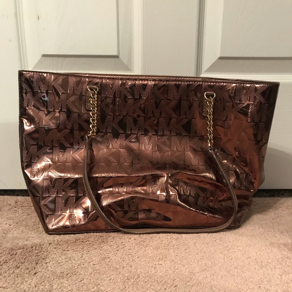 Shiny copper real Michael Kors purse.